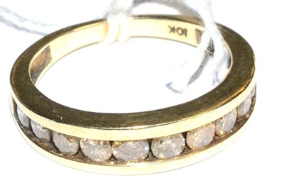 Lot 295 - A diamond half eternity ring, stamped '10K'