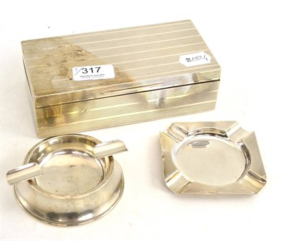 Lot 317 - Hinged silver cigarette box and two silver ashtrays (3)