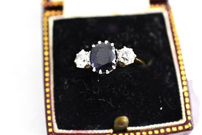 Lot 368 - A diamond and sapphire three stone ring