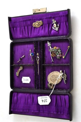 Lot 374 - A purple jewellery box containing a silver locket, a Scandinavian enamelled brooch, brooches etc