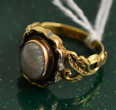 Lot 390 - An opal and black enamel mourning ring