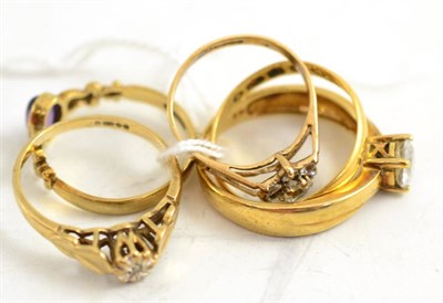 Lot 398 - A 22ct gold band ring and four 9ct gold rings (5)