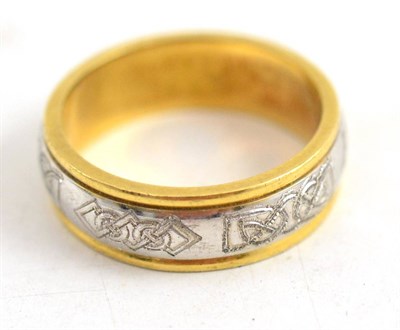 Lot 403 - An 18ct two colour gold band ring