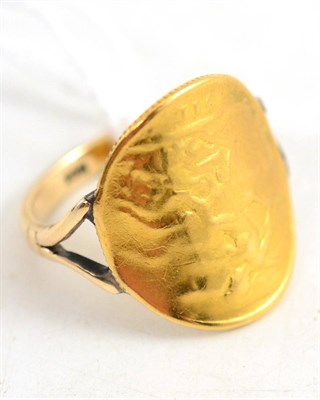 Lot 404 - A bent half sovereign ring, shank stamped ";9ct"