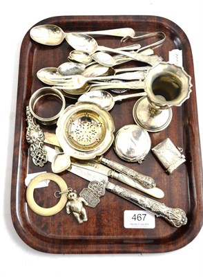 Lot 467 - Tray of silver including souvenir and other spoons, child's teething ring, small vase, etc