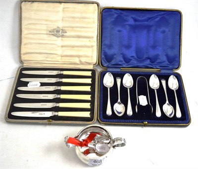 Lot 468 - A set of six silver teaspoons and tongs, a set of silver bladed knives, a cream jug and a set...