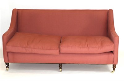 Lot 984 - A Victorian Style Three-Seater Sofa, upholstered in pink cotton fabric with two squab cushions...