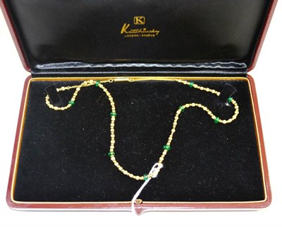 Lot 498 - A necklace marked Kutchinsky, with emerald beads, boxed