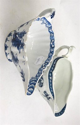 Lot 526 - Worcester blue and white 'Two Porter Landscape' sauce boat and another larger sauce boat (2)