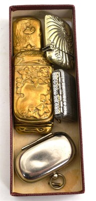 Lot 558 - A base metal vesta cases for 'Bryant & May Wax Vestas', four others and a plated sovereign case