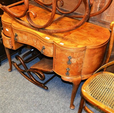 Lot 1018 - A circa 1930s walnut dressing table with serpentine front