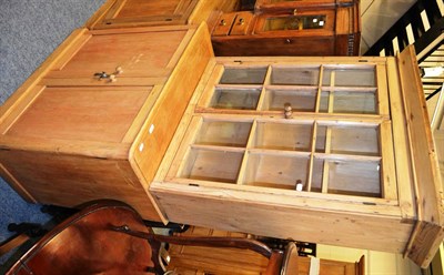 Lot 1023 - A pine two door cabinet and a pine glazed bookcase top