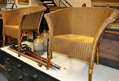 Lot 1033 - Two Lloyd Loom chairs, walking sticks, two Kendal stoneware bottles, cartridge shell etc