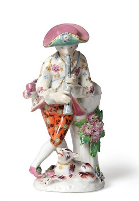 Lot 5 - A Bow Porcelain Figure of a Shepherd, circa 1765, leaning against a tree trunk playing pipes,...