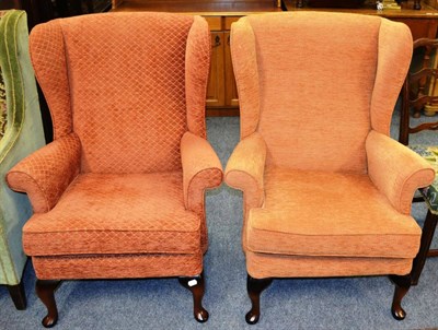 Lot 1049 - Two modern Parker Knoll wing armchairs, similarly upholstered