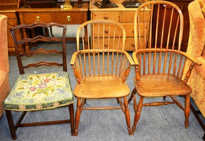 Lot 1050 - An elm Windsor armchair, two smaller chairs and a mahogany dining chair with wavy rail back (4)