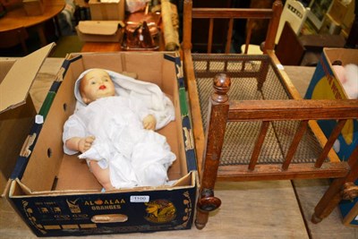 Lot 1100 - A Bronx DSL composition doll and a doll's bed