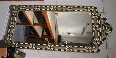 Lot 1140 - Large Eastern wall mirror with cushioned metal mounts and inlaid with bone