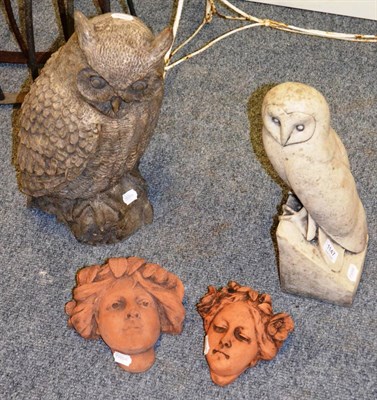 Lot 1147 - Concrete barn owl and long-eared owl and two terracotta wall pockets/planters