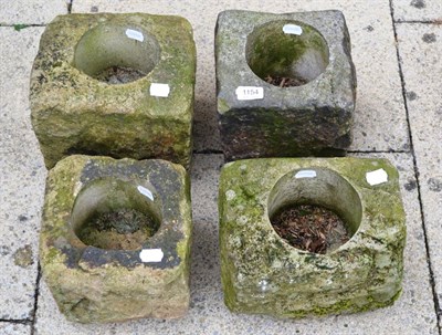 Lot 1154 - Four small stone troughs/garden planters