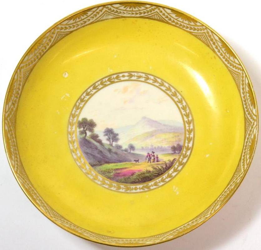 Lot 20 - A Pinxton Porcelain Saucer, circa 1800, painted with a  "View Near Baslow, Derbysh. " on a...