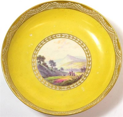 Lot 20 - A Pinxton Porcelain Saucer, circa 1800, painted with a  "View Near Baslow, Derbysh. " on a...