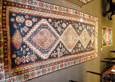 Lot 1211 - Kuba rug, North East Caucasus, the field of tribal motifs around three stepped medallions...