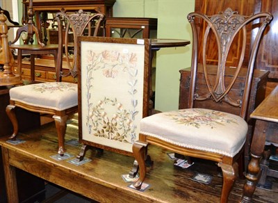 Lot 1221 - Pair of carved salon chairs with woolwork seats and an oak framed fire screen with floral silk...