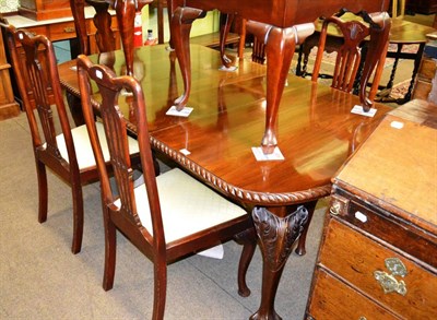 Lot 1230 - Extending table on claw and ball feet and five Queen Anne style chairs