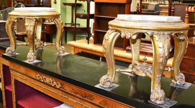 Lot 1233 - Pair of carved giltwood plant stands with marble tops (later)