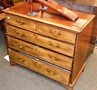 Lot 1236 - A George III mahogany chest of two short and three long graduated drawers