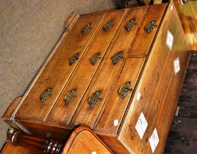 Lot 1240 - A Georgian oak chest of two short and three long drawers