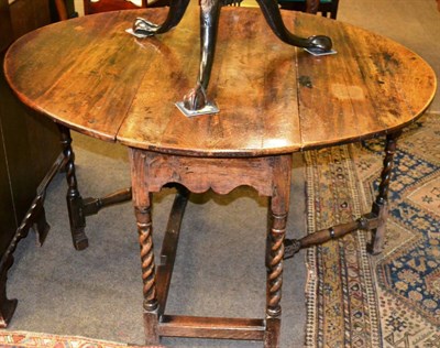 Lot 1241 - An 18th century oak gate leg table