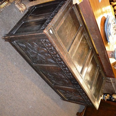 Lot 1257 - An 18th century carved oak blanket chest