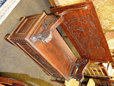 Lot 1272 - A carved oak monks bench