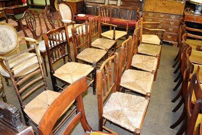 Lot 1273 - Two rush seated carver chairs, seven spindle back dining chairs and a ladder back chair (10)