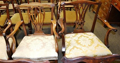 Lot 1278 - A 19th century mahogany elbow chair and a similar chair with carved splats and yellow damask...