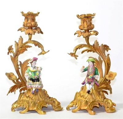 Lot 32 - A Pair of Minton Porcelain and Ormolu Candlesticks, circa 1860, as a boy and girl holding fruit and