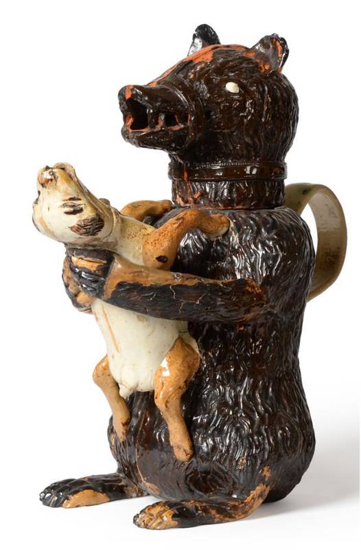 Lot 34 - A Staffordshire Pottery Bear Jug and Cover, early 19th century, the naturalistically modelled...