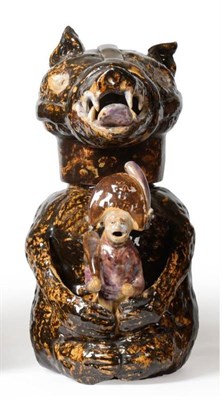 Lot 35 - A Pratt Type Pottery Bear Jug and Cover, circa 1800, naturalistically modelled seated holding a...