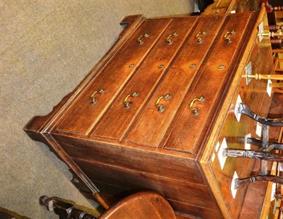 Lot 1311 - A Georgian oak four height chest of drawers