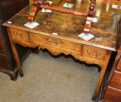 Lot 1313 - An early 19th century oak low boy