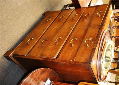 Lot 1322 - An oak five height chest of drawers