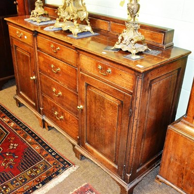 Lot 1361 - A Georgian oak dresser base