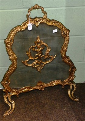 Lot 1373 - Gilt metal firescreen in the Louis XV style