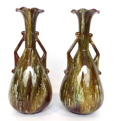 Lot 45 - 1839 A Pair of Linthorpe Pottery Twin-Handled Vases, green and white running glaze on a brown...