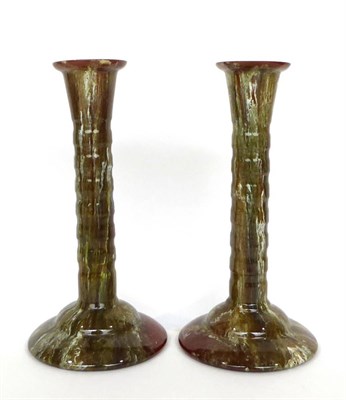 Lot 46 - 1927 A Pair of Linthorpe Pottery Candlesticks, green and white runny glaze, on a brown ground,...