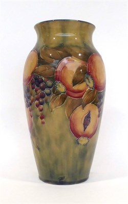 Lot 63 - A William Moorcroft Pomegranate Pattern Vase, on a mottled green ground, green painted...