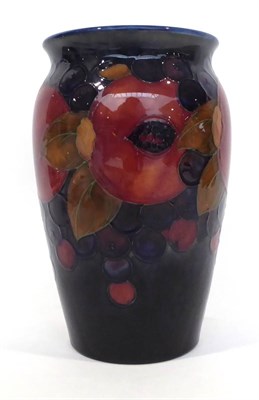 Lot 64 - A William Moorcroft Pomegranate Pattern Vase, on a blue ground, blue painted signature,...