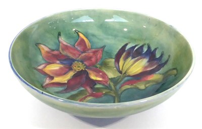 Lot 68 - A Walter Moorcroft Clematis Pattern Bowl, on a blue/green wash ground, blue painted monogram,...